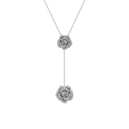 Silver necklace with floral pendants on a white background