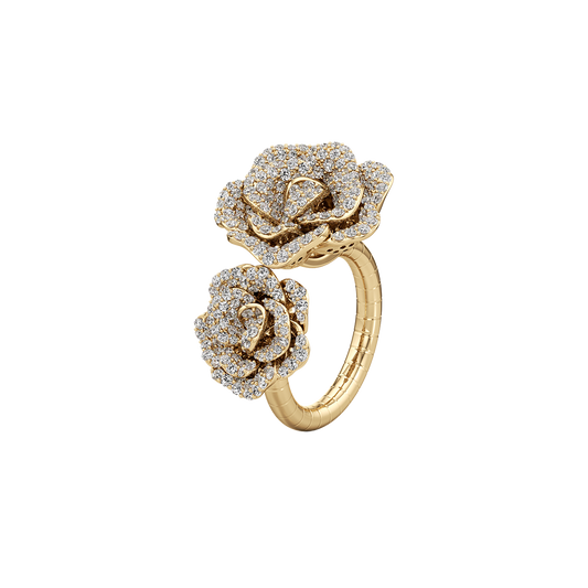 Gold ring with diamond-studded rose designs on a white background
