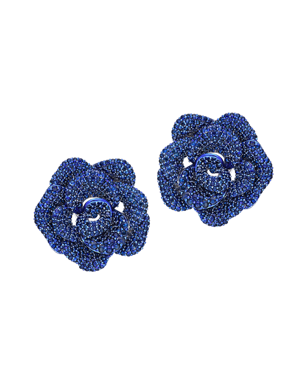 Pair of blue rose-shaped earrings on a white background