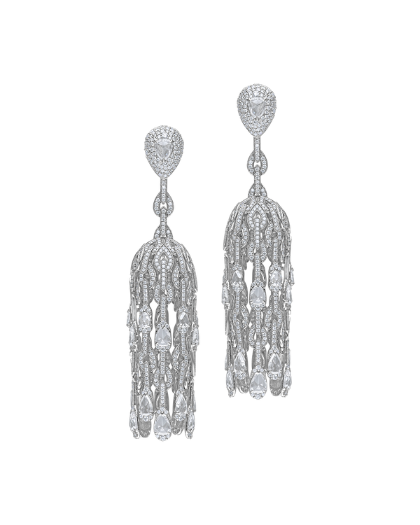 Pair of silver tassel earrings on a white background