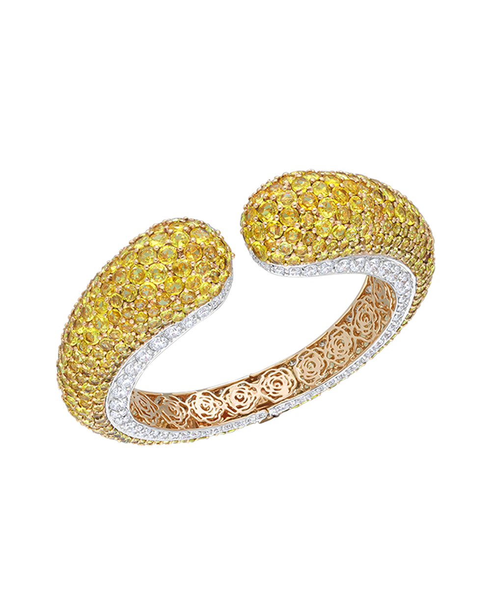 Gold and silver bracelet with yellow gemstones on a white background