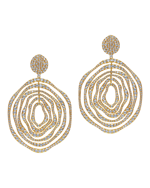 Gold and diamond earrings on a white background