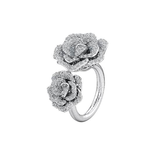 Silver ring with rose-shaped diamond designs on a white background
