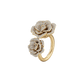Gold ring with diamond-studded rose designs on a white background