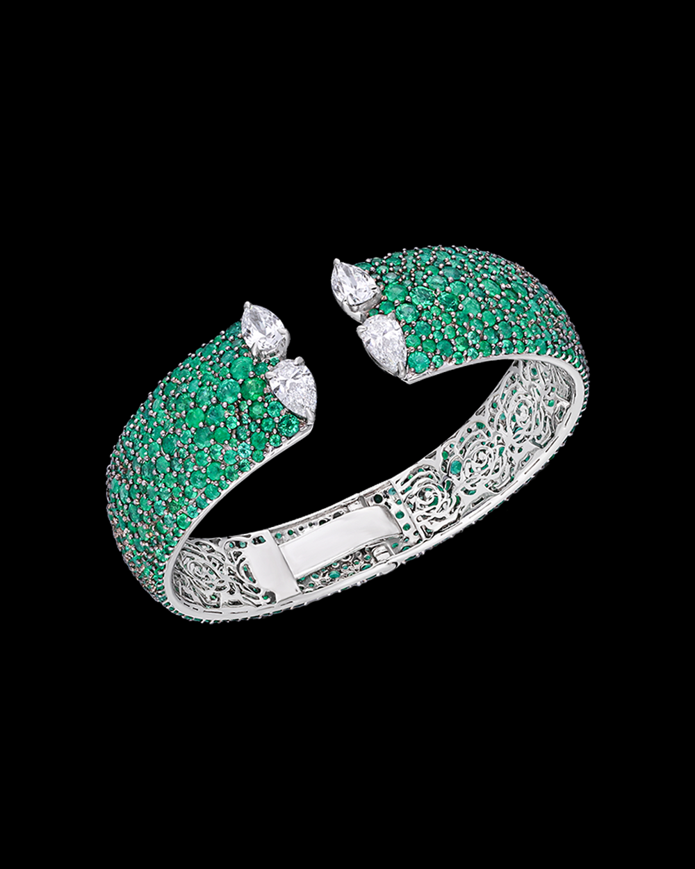 Green gemstone bracelet with silver accents on a black background